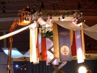Banners being hoisted up to the ceiling